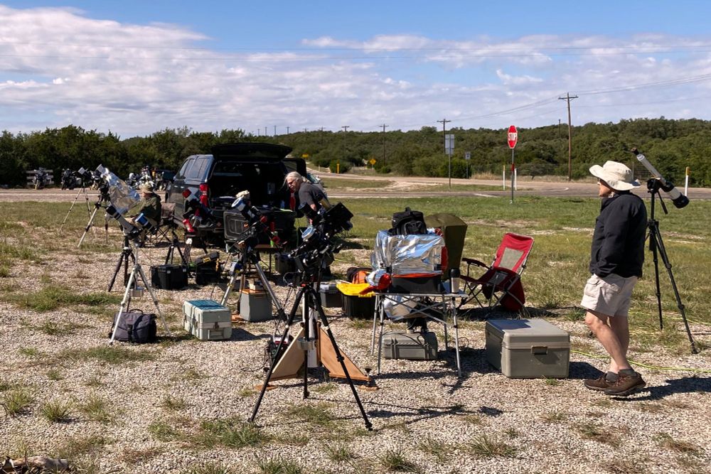 This image shows photography and astronomy gear in use during the eclipse.  All of the gear on this side of the road is ours and fit in to the back of that pickup.  There were four of us.