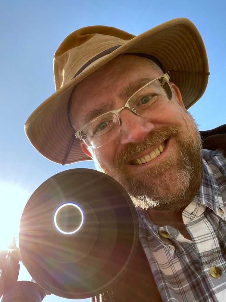 This is a self portrait with the "ring of fire" eclipse.  The device I am using is a home built solar projector.