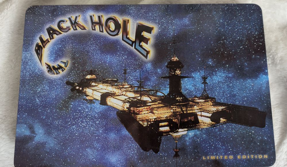 A metal box with Cygnus spacecraft from The Black Hole