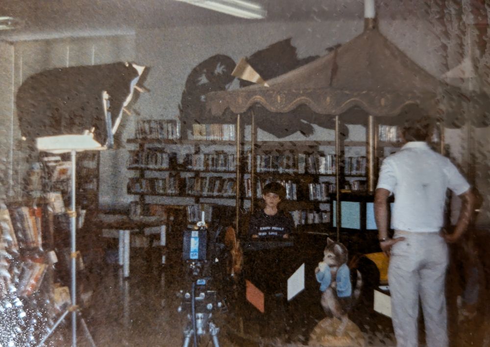 Me a long time ago. I'm sitting behind a small merry-go-round waiting to be filmed.