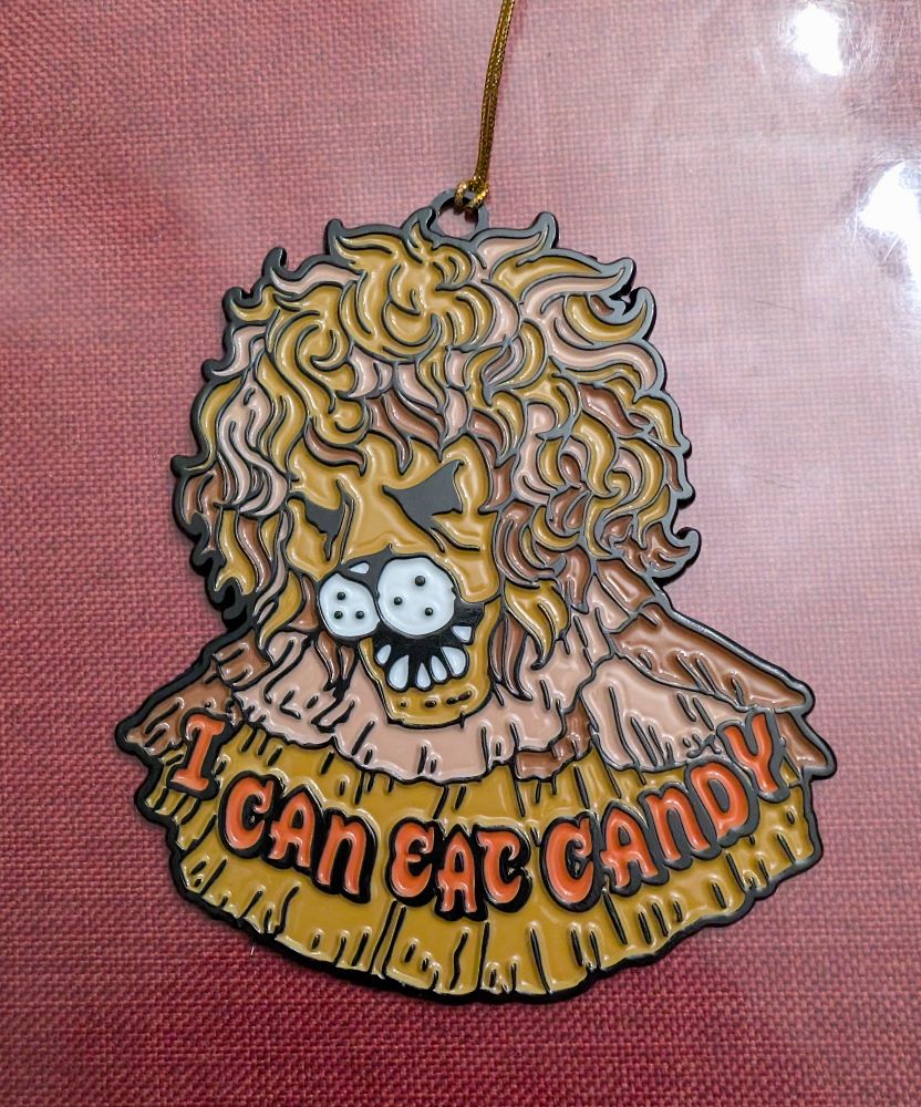 An ornament featuring the Candy Lion from Santa and the Snow Fairy Queen. It features his endearing catch phrase I CAN EAT CANDY. Good for him!