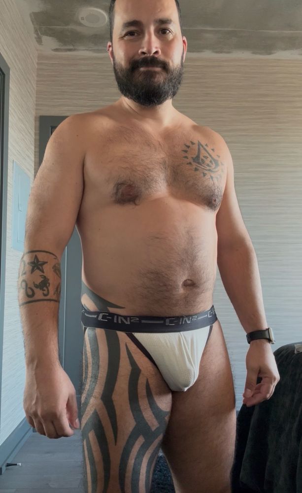 Standing wearing only a white jockstrap from C-in2