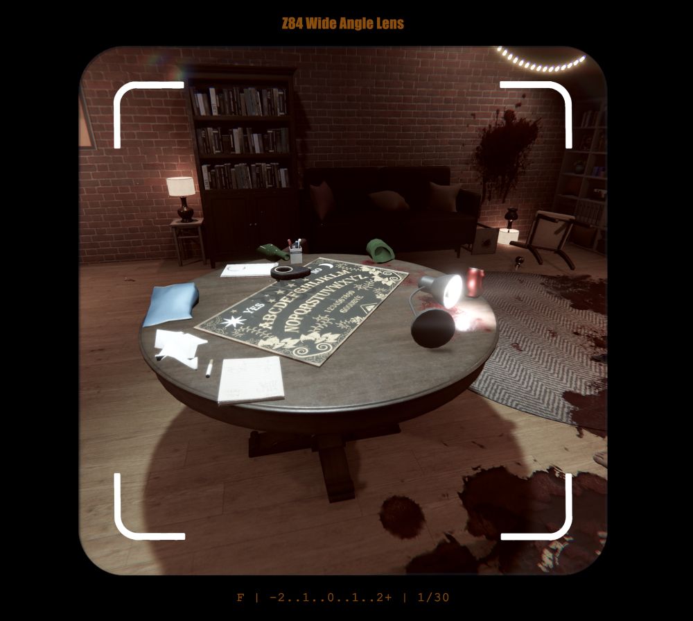 A view through a wide angle camera lens, it is focused on a round wooden table with an ouija board resting on it. Blood pools on the floor and across a rug in the background. It’s all totally normal and fine.