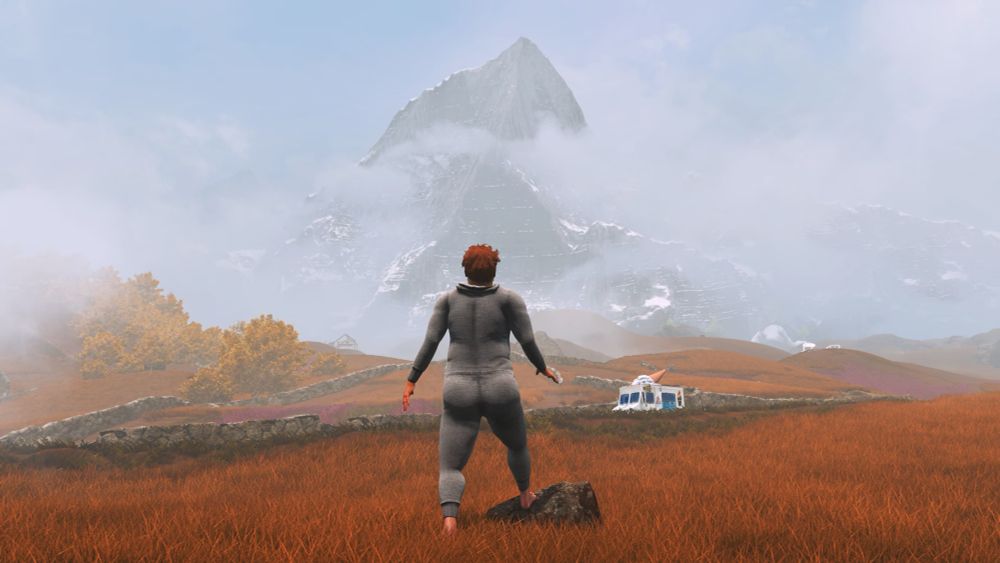 Nate, the protagonist of the game Baby Steps, takes one more step towards a distant, mist-shrouded mountain