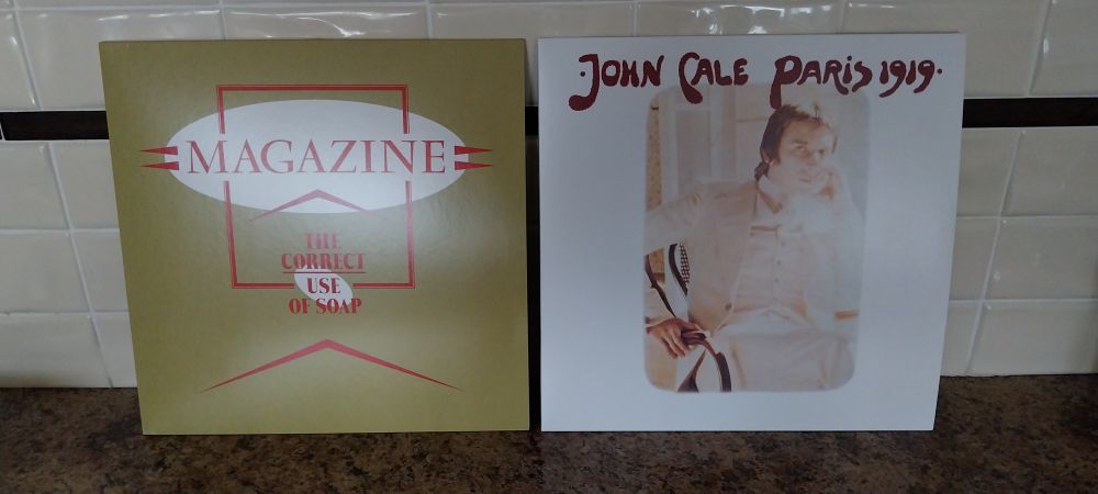 A picture of 'The Correct Use of Soap' by Magazine and 'Paris 1919' by John Cale. 