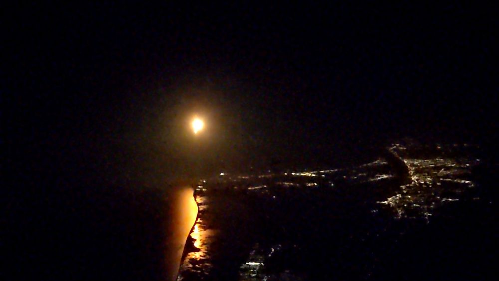 The same view, with the fireball already approaching our altitude. The line of the Canaveral National Seashore is clearly defined in the reflection.