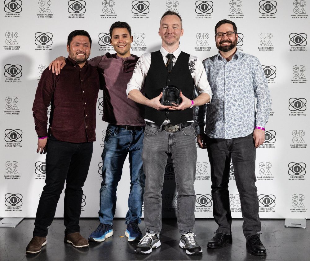 Team photo with award. Left to right it's Steve Lee, Robert Arzola, Tom Francis, and John Winder. Sadly absent: John Roberts.