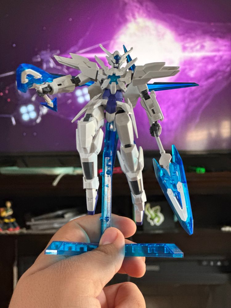 HG Transient Gundam, a white and blue mobile suit. It carries matching spears in each hand