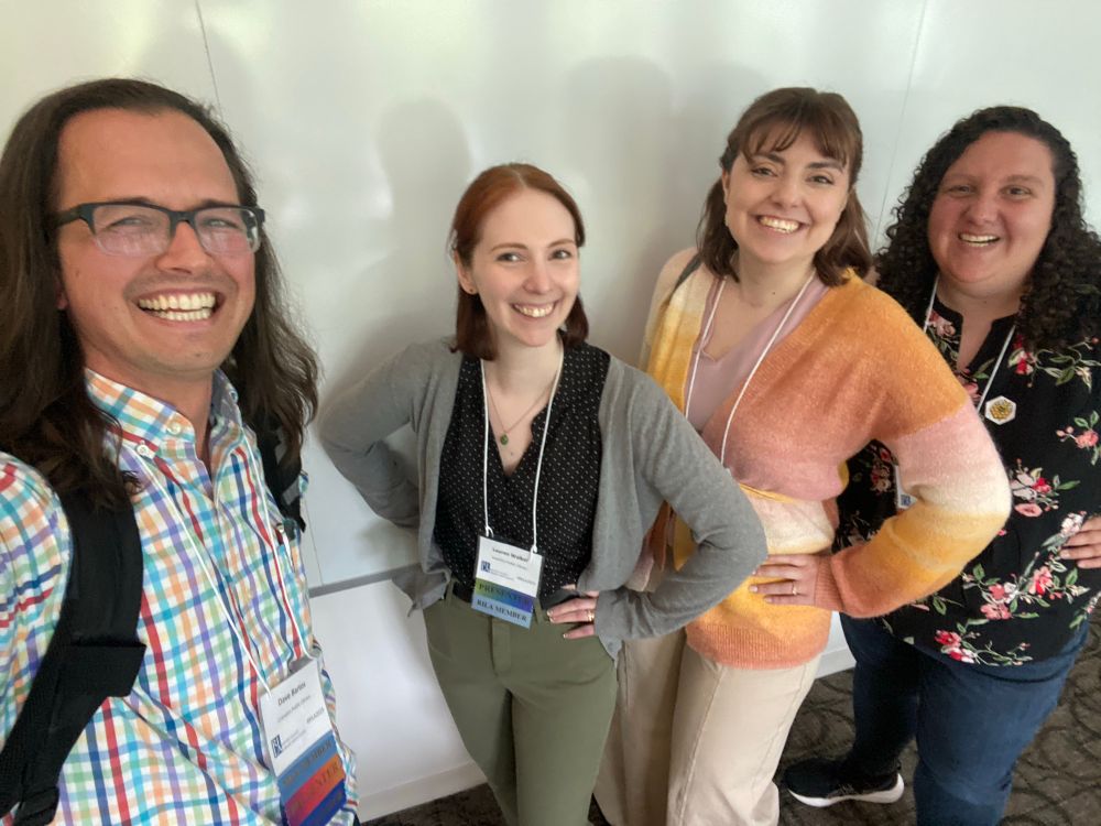 Dave, Lauren, Tayla, and Emily smiling after their presentation at the Rhode Island library association annual conference. 