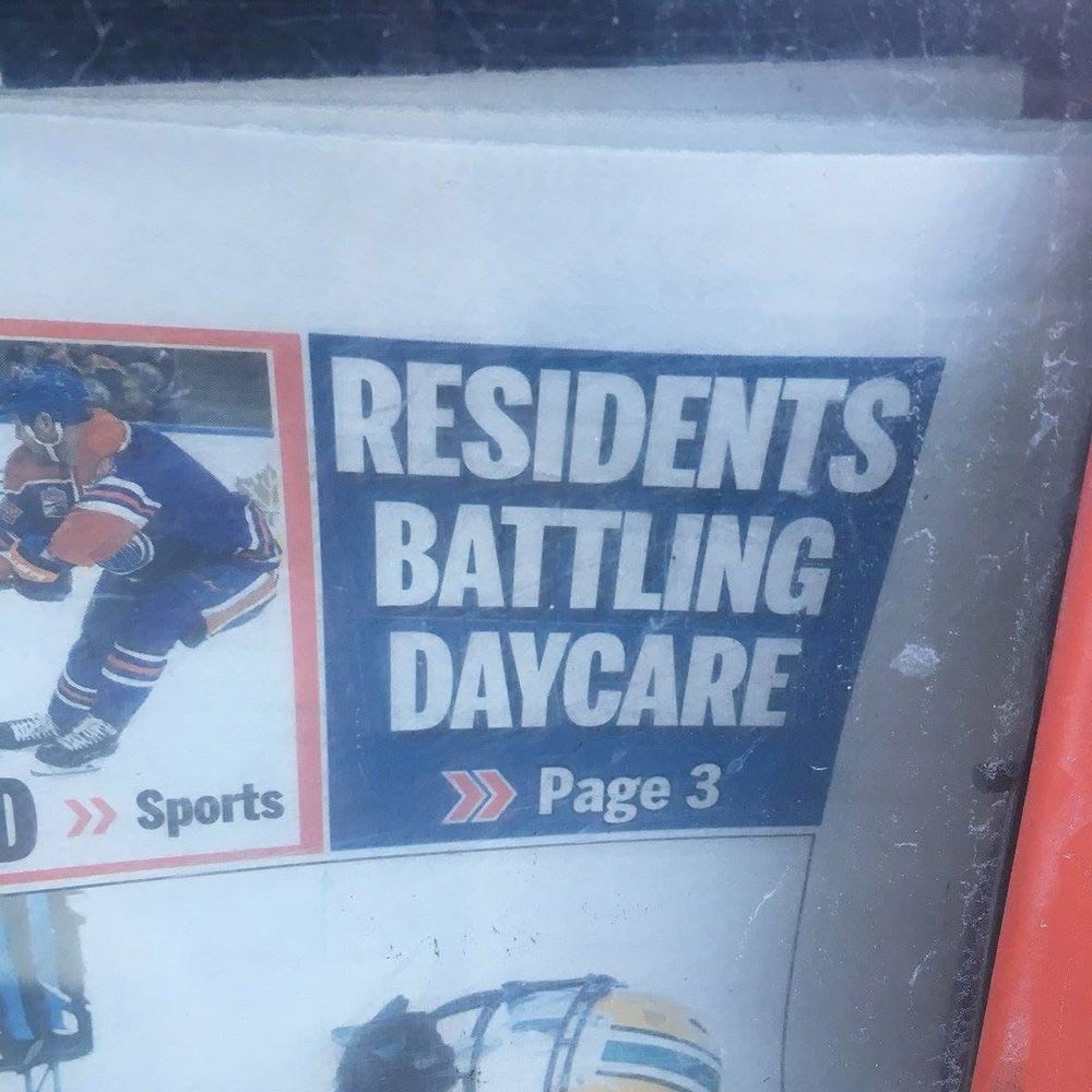 A newspaper headline reading “RESIDENTS BATTLING DAYCARE Page 3”