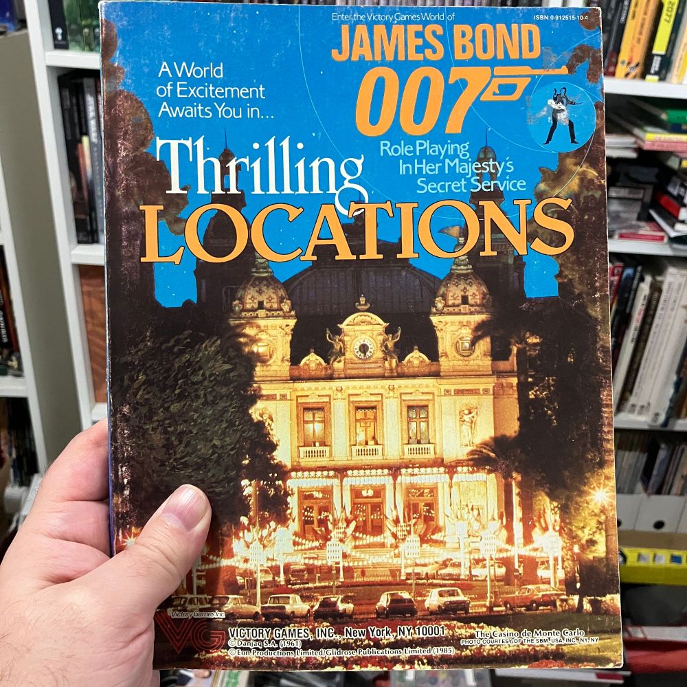 Cover of Thrilling Locations for the James Bond 007 RPG from Victory Games featuring the entrance to the Casino de Monte-Carlo at night.