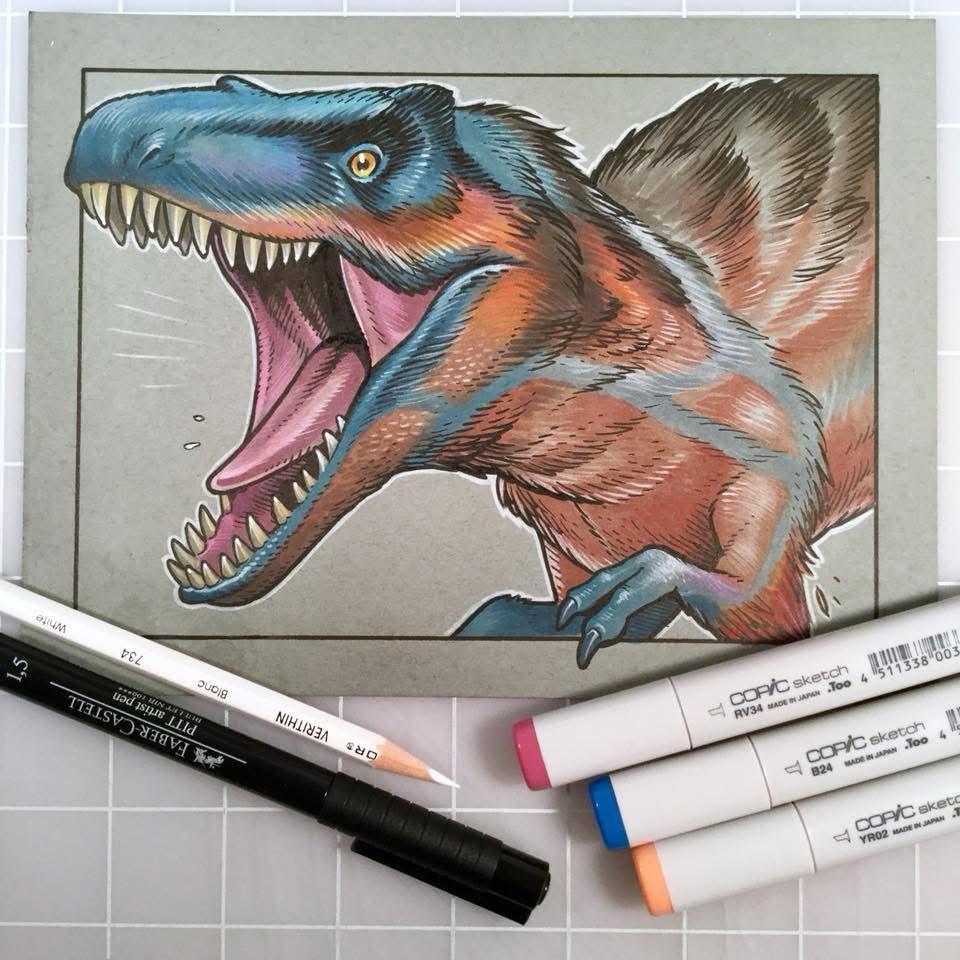 A marker and coloured pencil drawing of a dinosaur with blue and rust coloured feathers. Below the drawing are a white pencil, a pen, and three Copic markers. 