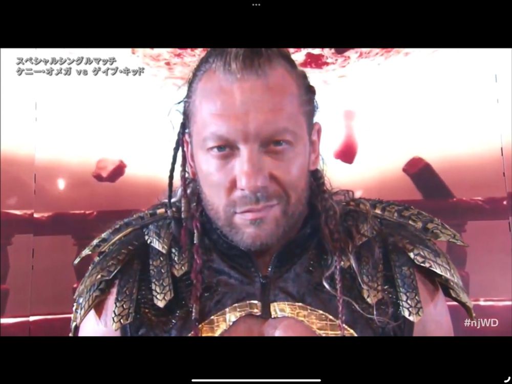 Kenny Omega smirks at you with the power of a horny god. 