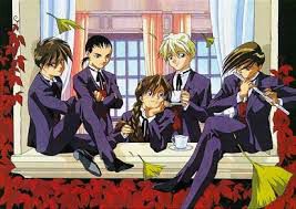 The Gundam wing boys in nice matching suits, arranged at a large windowsill. Heero is sitting to the left, Wufei is standing next to Quatre who is holding a cup of tea, Duo is kneeling on the windowsill like he’s about to burst into an I Want song, and Trowa is playing the flute. This is genuinely one of the prettiest pieces of anime art I’ve ever seen, I love it so much 