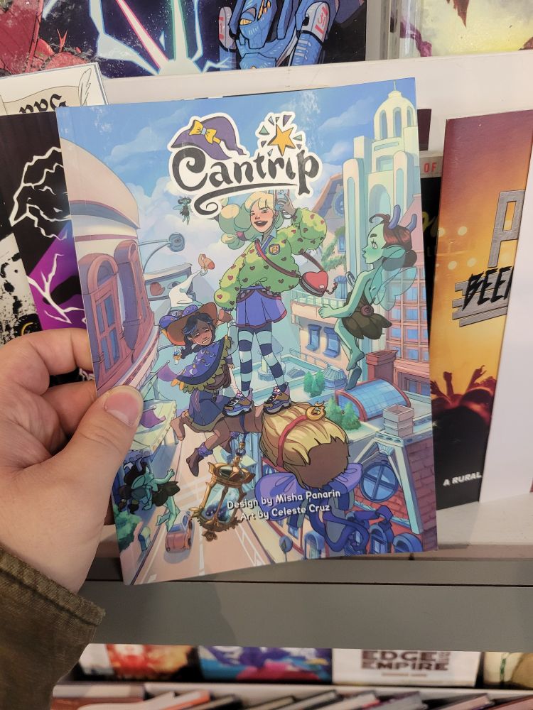 A print copy of the TTRPG Cantrip designed by Misha Penarin and art by Celeste Cruze