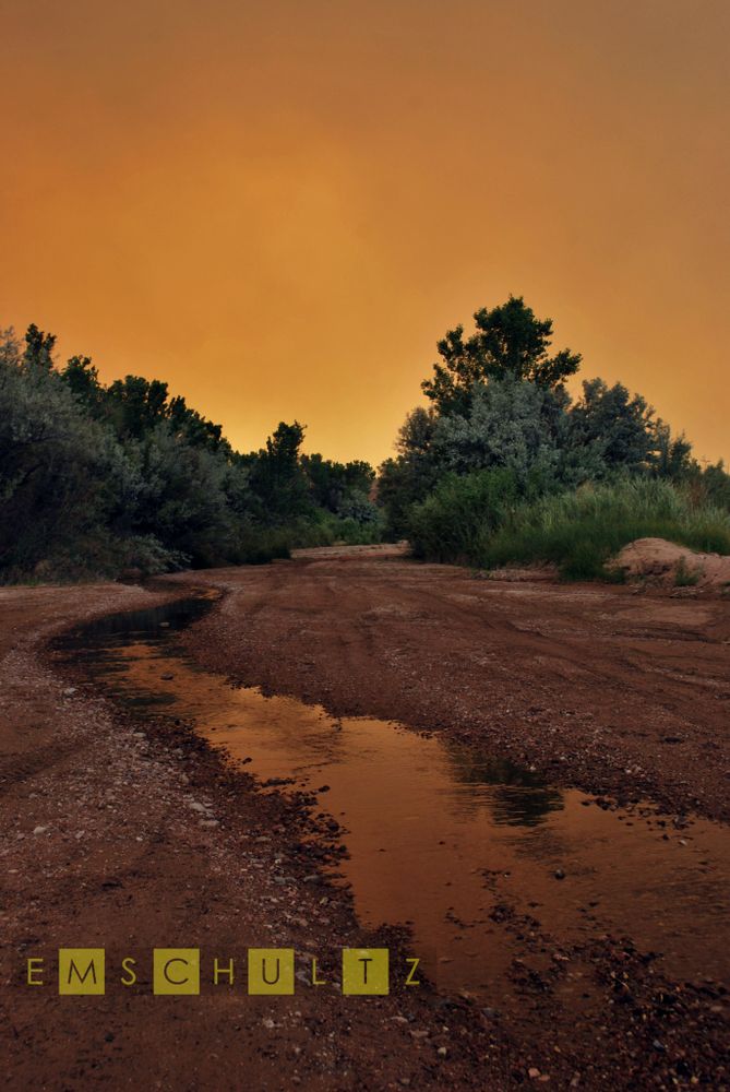 Ash and smoke obscured skies some 20 miles from the hypocenter of the Las Conchas Wildfire - Arroyo Jacona - Jacona, New Mexico - 27 June 2011.