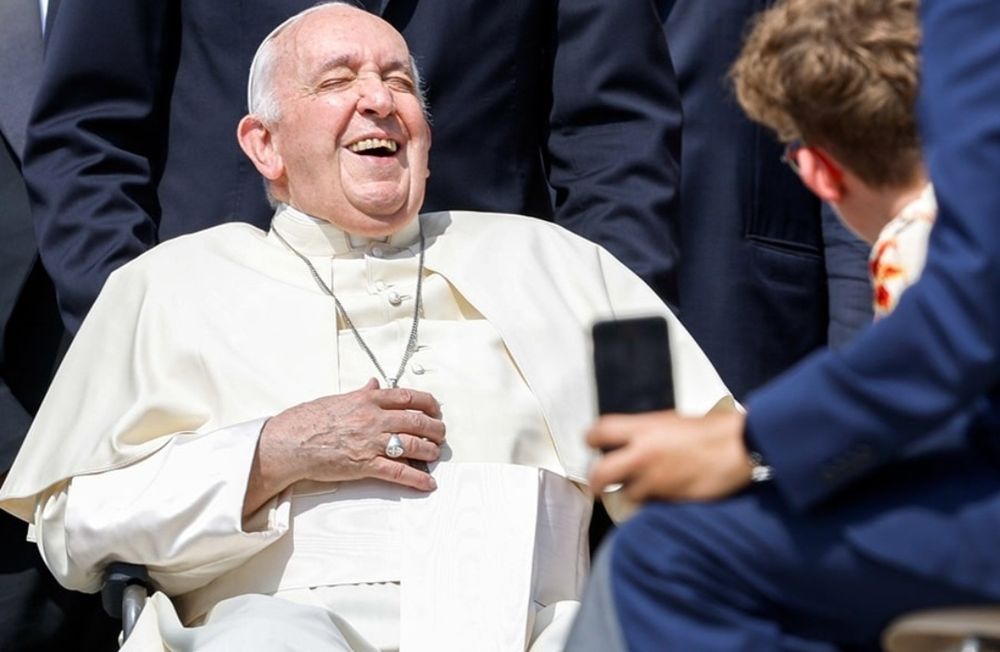 Pope Laughing at something funny.