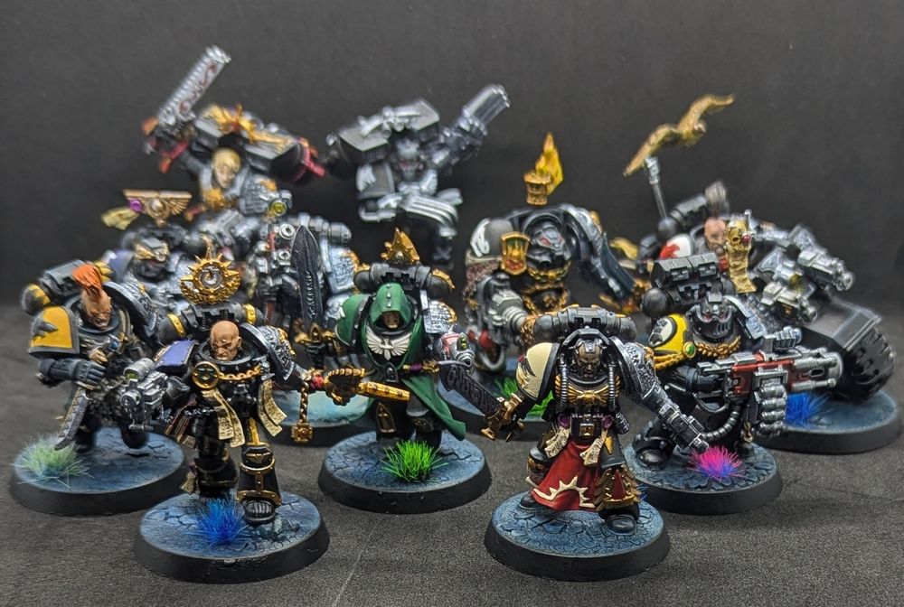 A squad of Warhammer 40k Deathwatch Space Marines in a variety of armour styles and equipment 