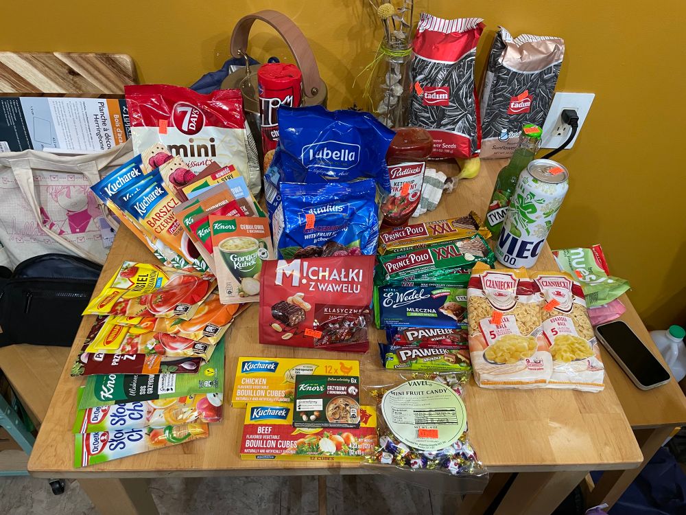 like a hundred bucks of polish imported dry groceries covering a table