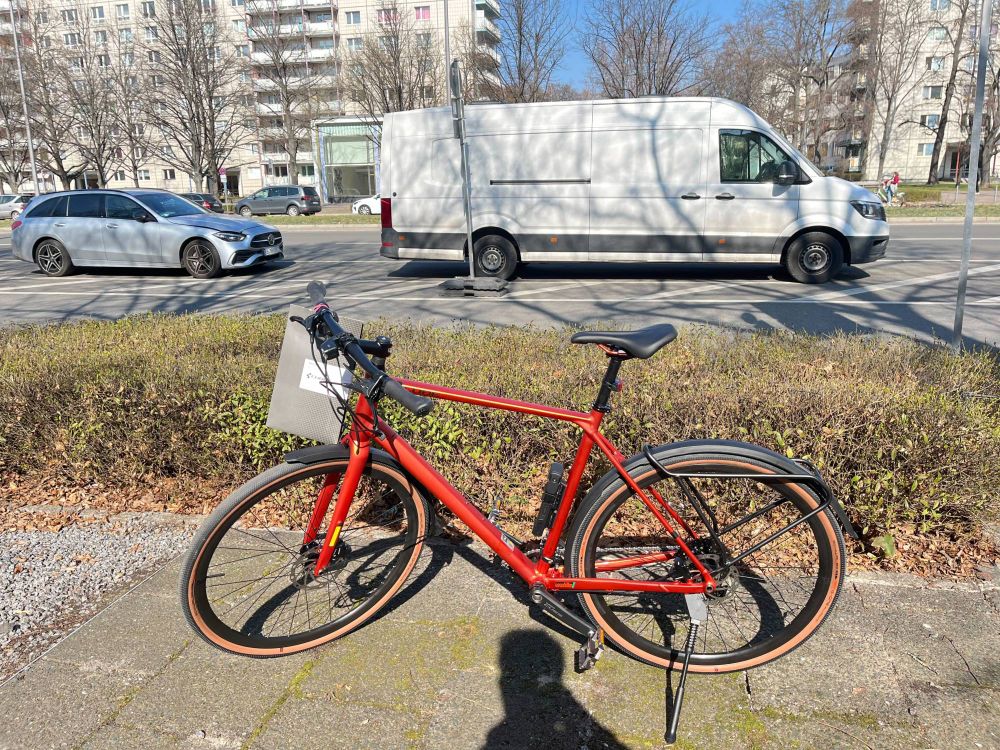 The fresh orange color city/touring bike on the street