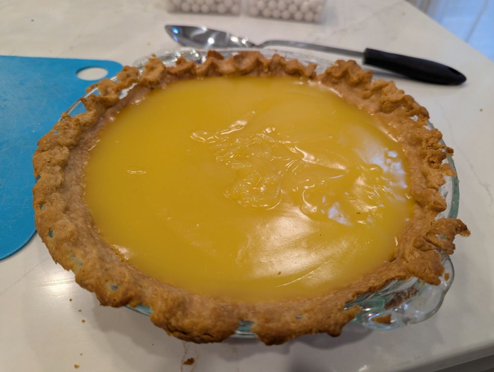 A homemade pie crust filled with lemon curd.
