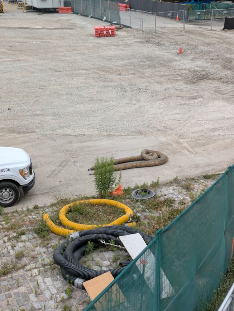 object resembling a giant sized poo on a construction site 