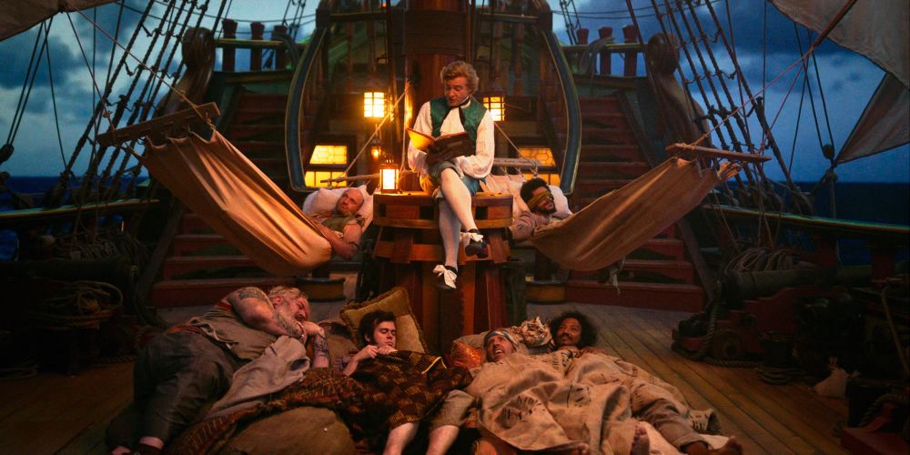 Stede reading a bedtime story to the crew on deck