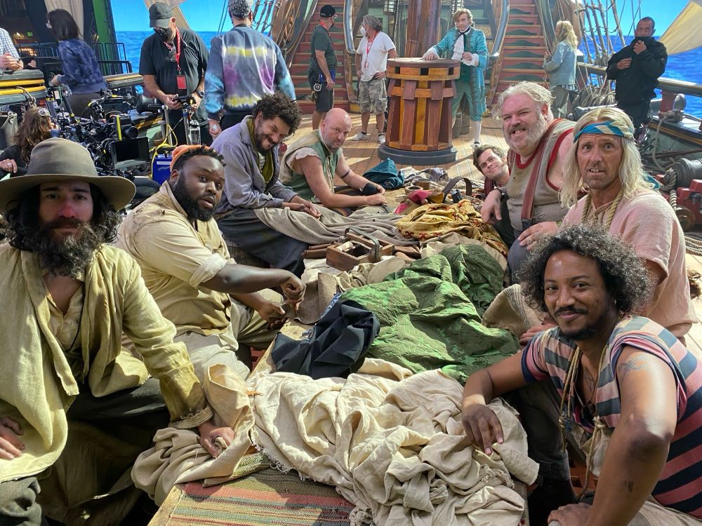 BTS from Samba showing the crew making flags (and the show crew wandering around in the background. And Stede looking Stede-y) 