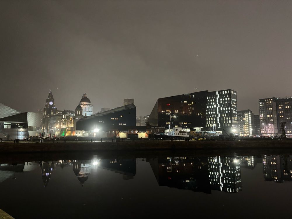 Night time view across Canning Dock of the Liverpool waterfront 