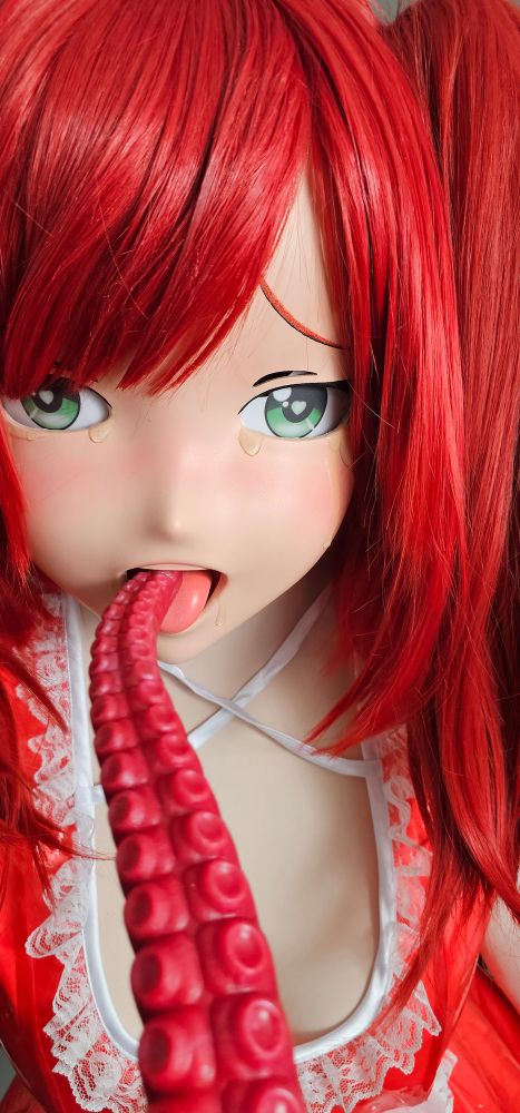 red head twintail kigurumi in red plastic dress eating a red tentacle