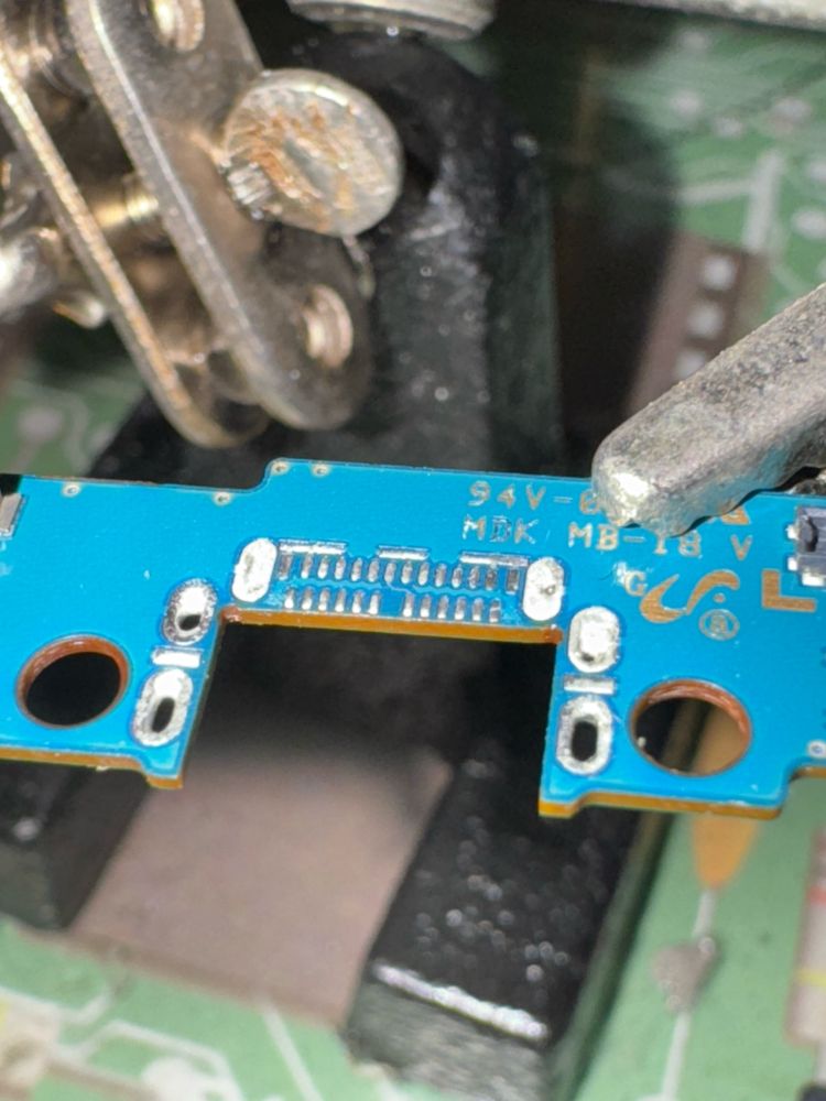 macro photograph of PCB with solder pads exposed