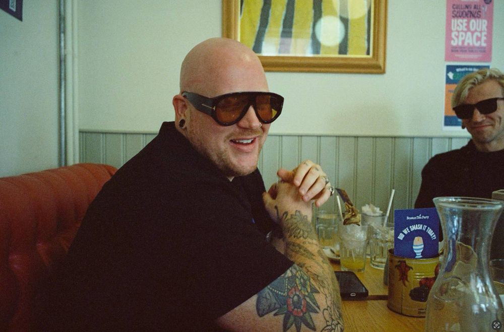 me and user Henry Online wearing sunglasses, indoor diner shot.