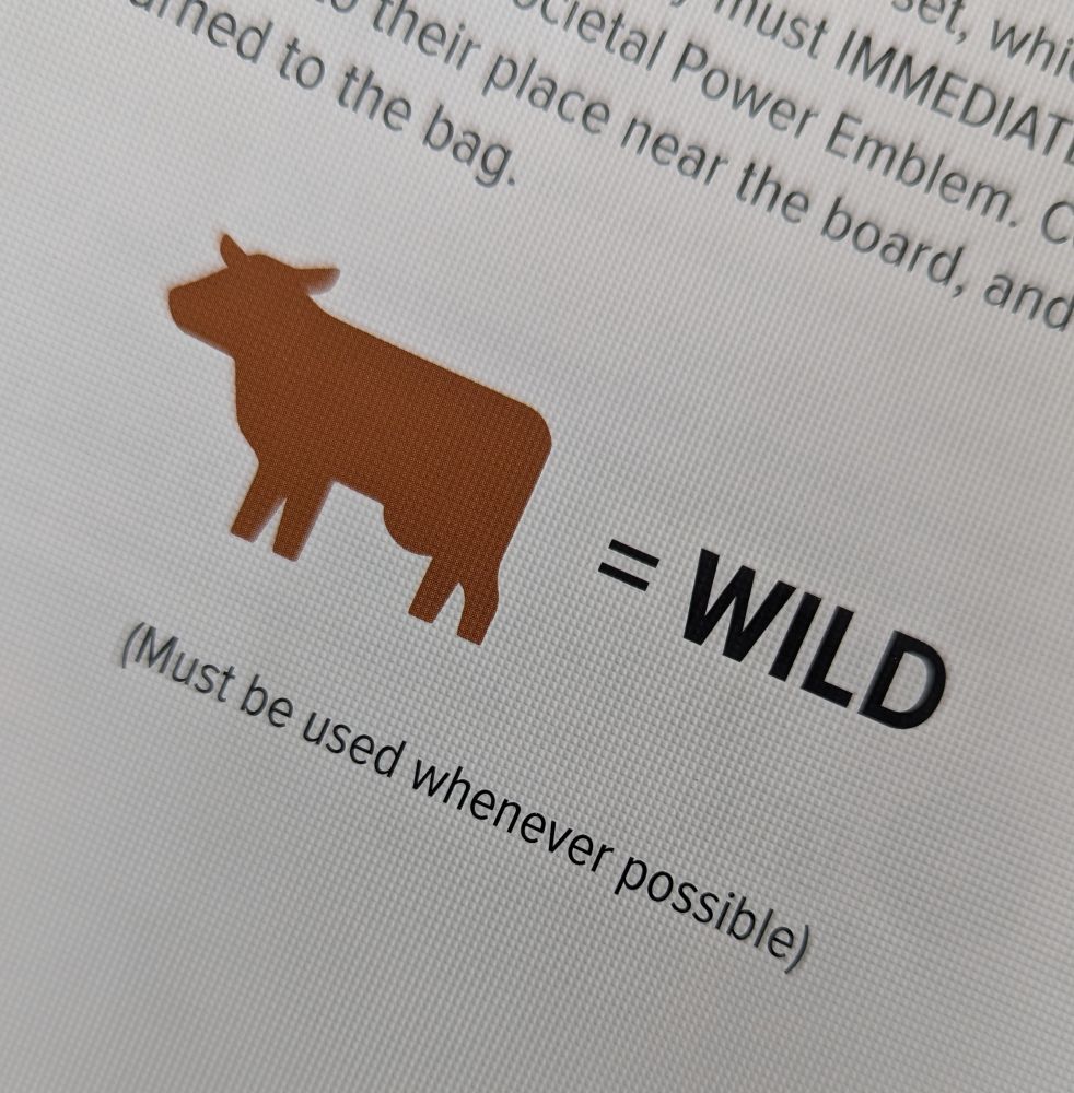 a cow in a board game rulebook. it clearly states "cows = wild". its a bit silly.
