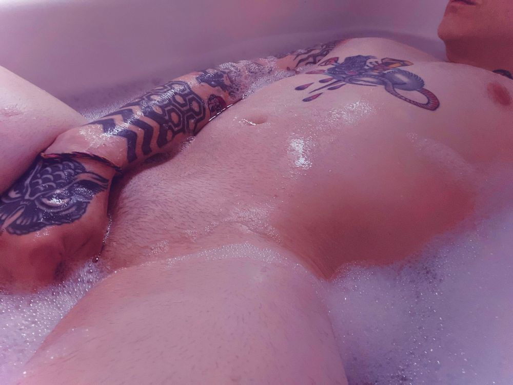 nsfw queer tattooed enby in the bath