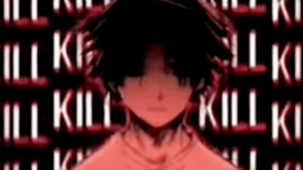 a man in a red shirt is standing in front of a wall with the words kill on it .