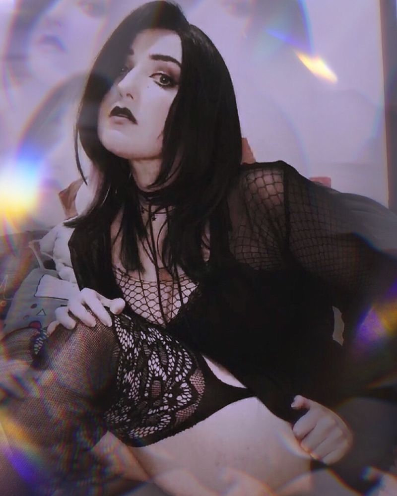 Gothic woman in black lace and Gothic makeup 