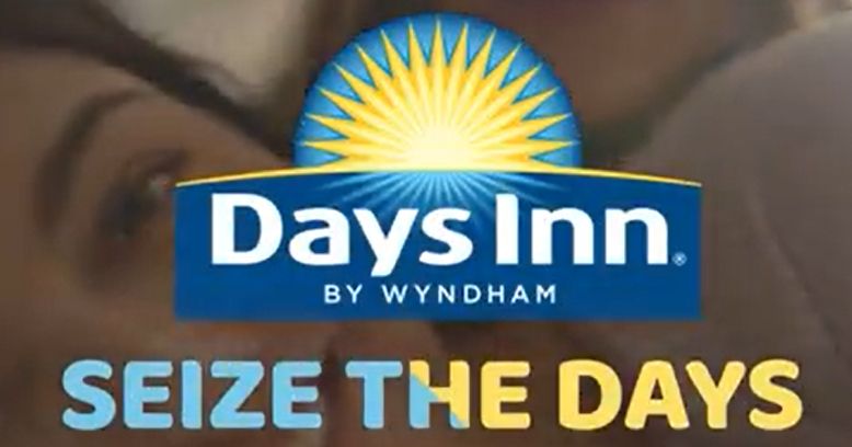 The Days Inn logo, a sunburst, above the slogan "Seize the Days"