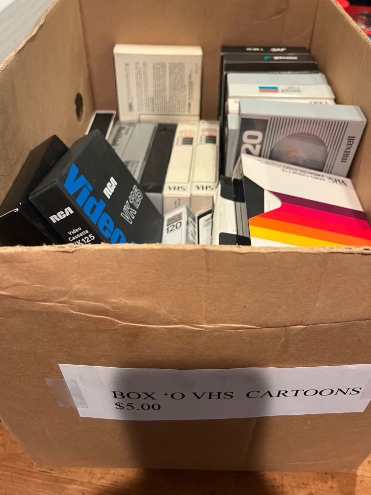 Big cheep box of home recorded cartoons on vhs.