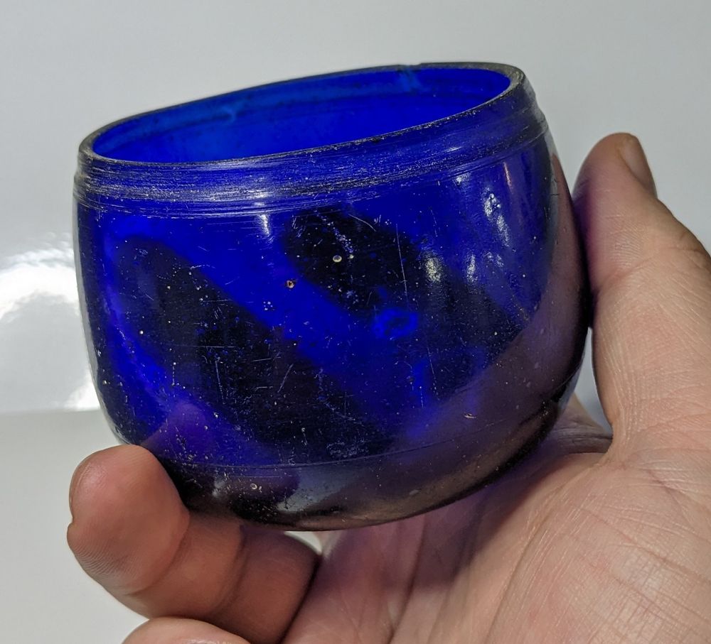 A small cobalt blue glass cup with abraded line decoration.

MU4979 - Donated under the Australian Government's Cultural Gifts Program by Janet Gale 2018