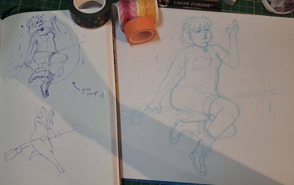 Photo of a sketchbook and sketchpad with 4 black and orange washi tape rolls on them. Both sketchbook and sketchpad show a sketch of a girl in with costume on a broom.