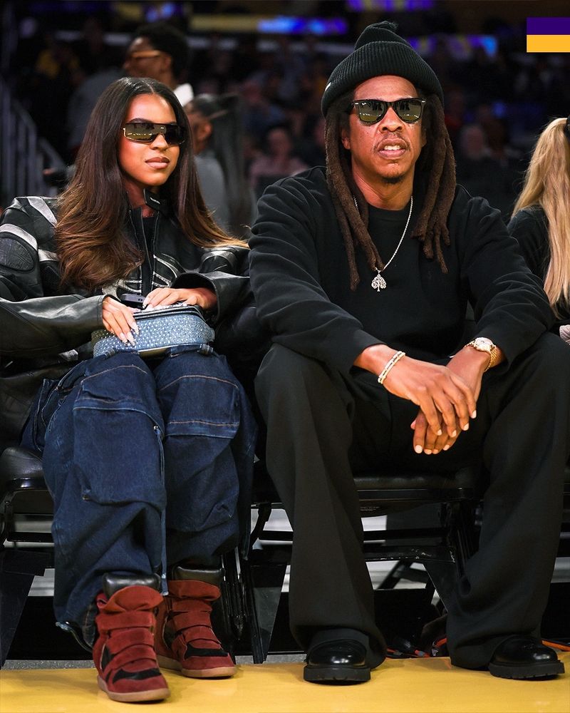 Blue Ivy and Jay-Z at the Lakers game wearing doubtlessly expensive clothing