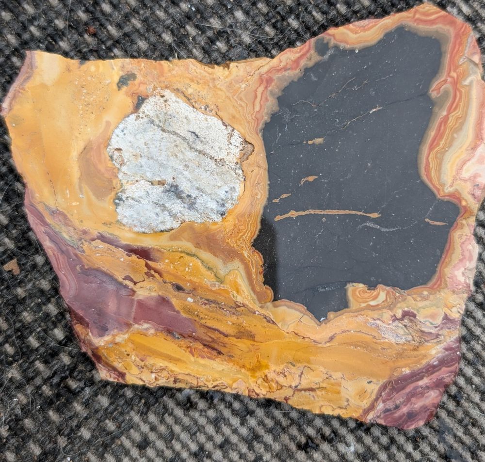 Another slab of black, red, orange and white