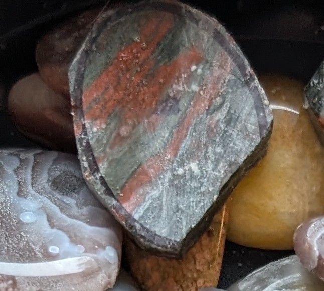 One of the slabs cut into an oval, but the bottom edge has broken off
