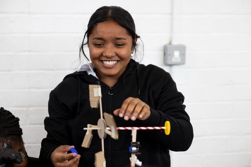 A school student building a model of a wind turbine
