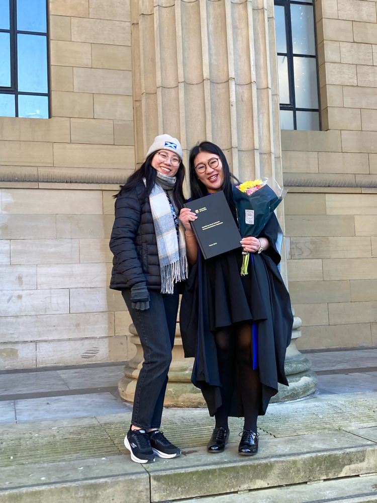 Vivien Shek, her PhD thesis, and Nicole. It is very cold today!
