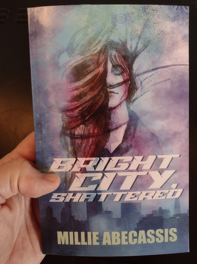 The book cover for Bright City, Shattered, by Millie Abecassis.