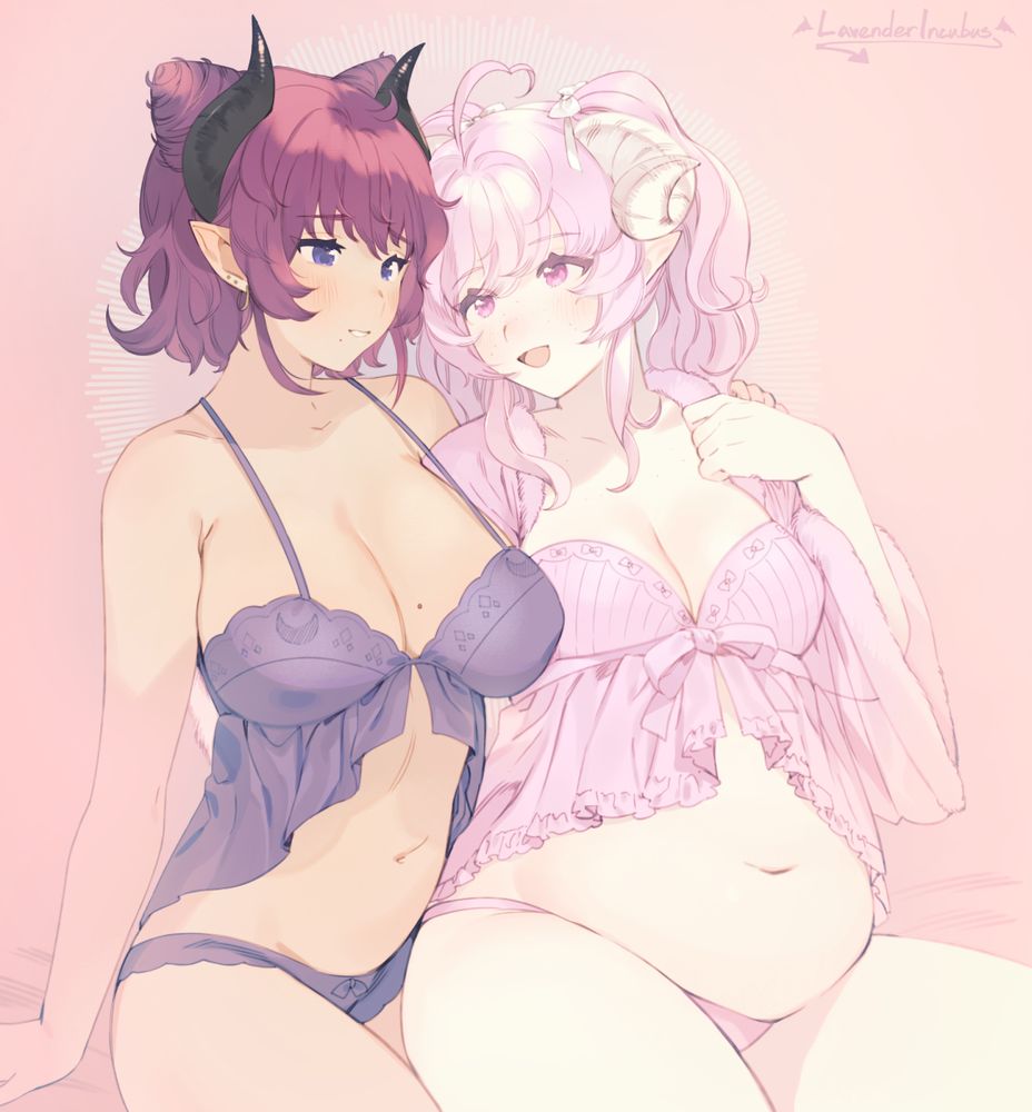 two ladies with horns and pointed ears wearing matching lingerie