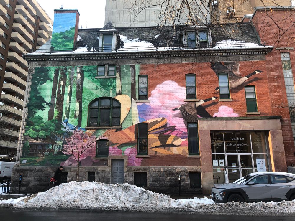 A mural depicting geese taking flight.