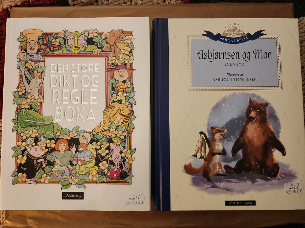 Two hardcover books of Norwegian-language fables and fairy-tales