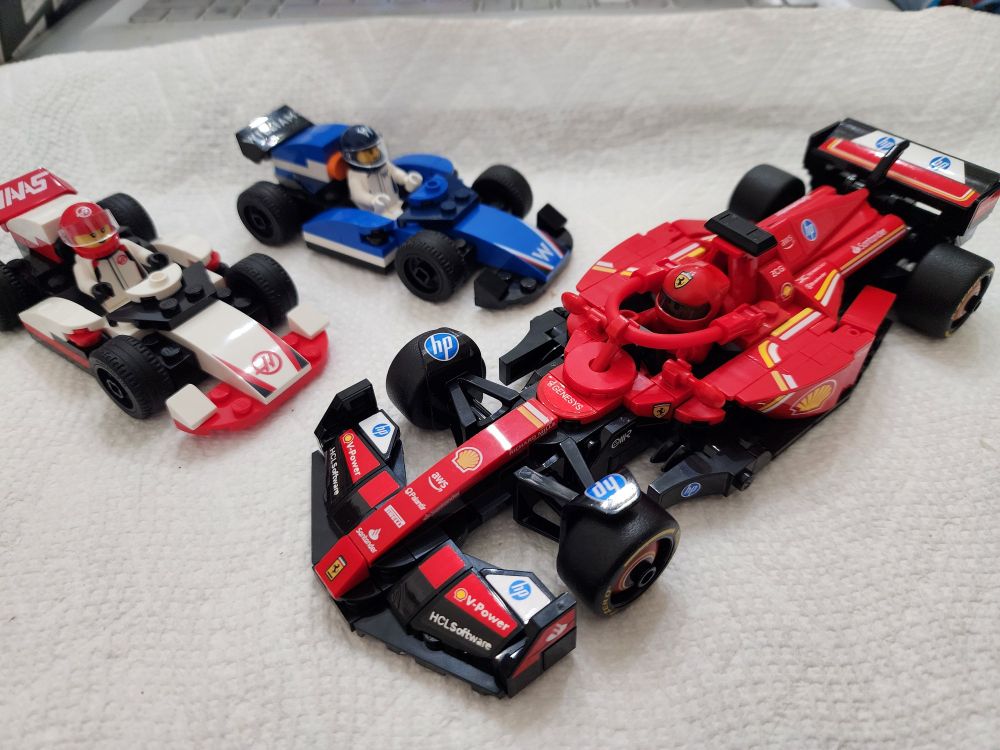 Three LEGO models of Formula 1 cars
